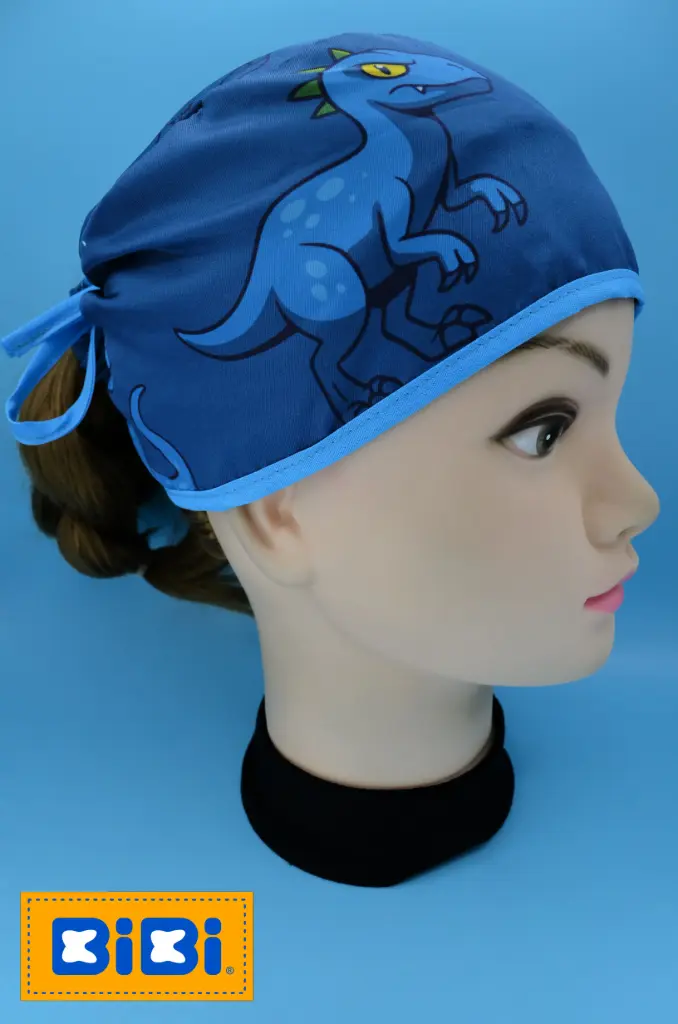 Dinosaurio azul (Gorro Corto (Medidas: 9.5 cm de altura, 58 cm de circunferencia, con cintas para amarrar))